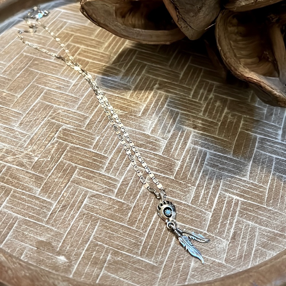 Sterling silver bear claw with feathers necklace